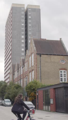 Vertical-Video-Showing-Exterior-Of-Contrasting-Housing-Types-In-London-Tower-Hamlets-UK-4